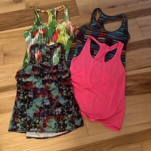 Lot of 4 size medium Athleta tank tops